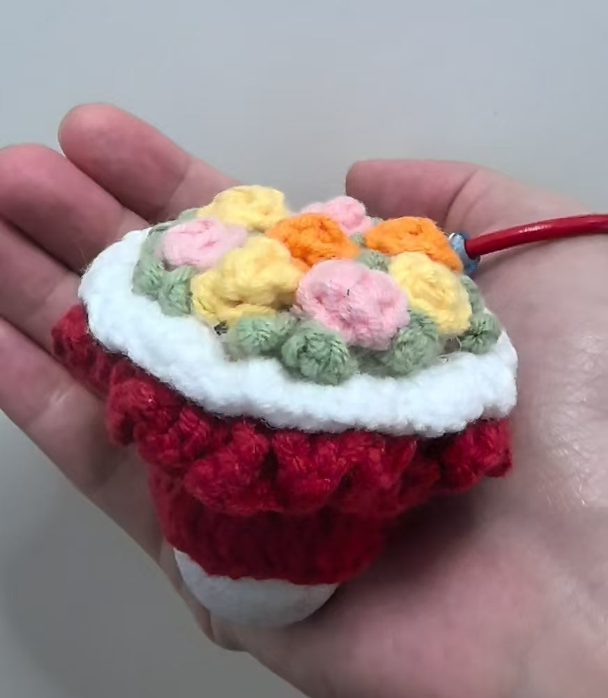 Crocheted pendant - A bouquet of red flowers