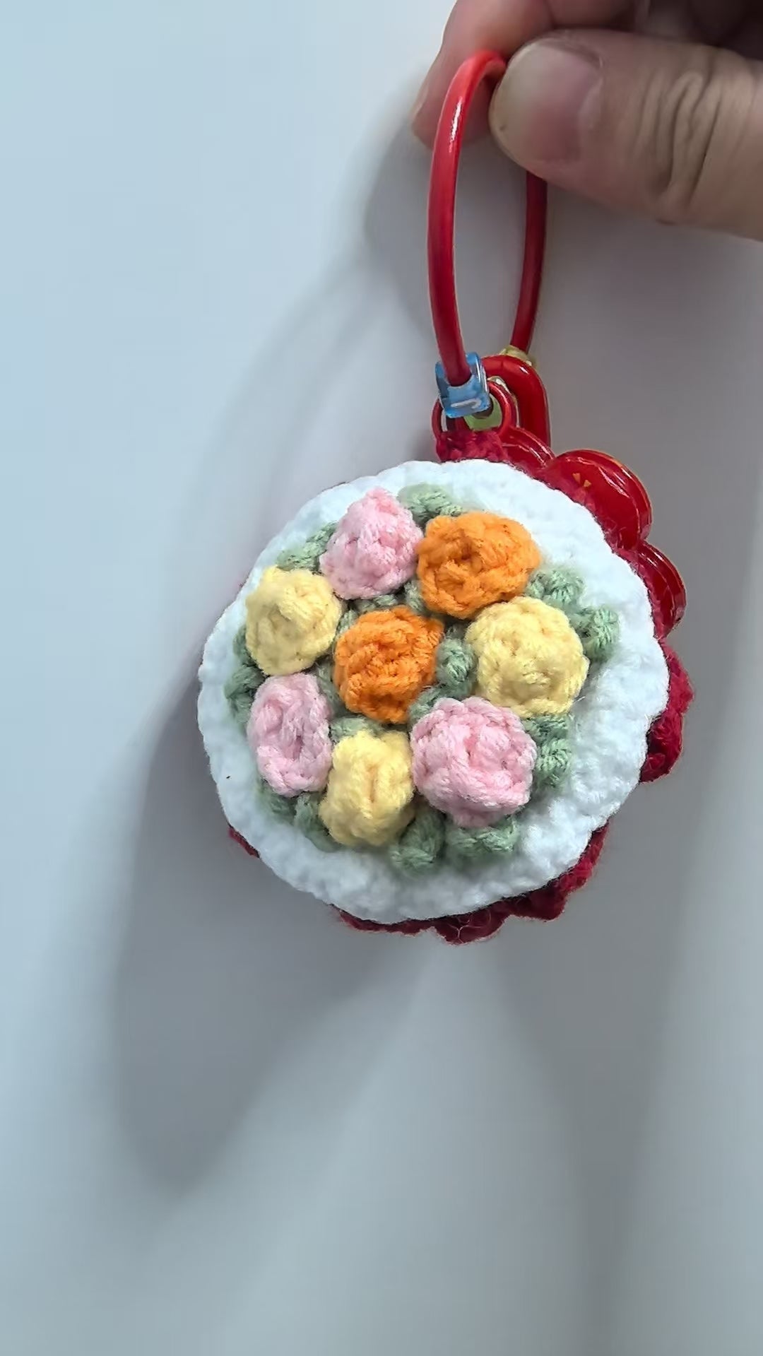 Crocheted pendant - A bouquet of red flowers