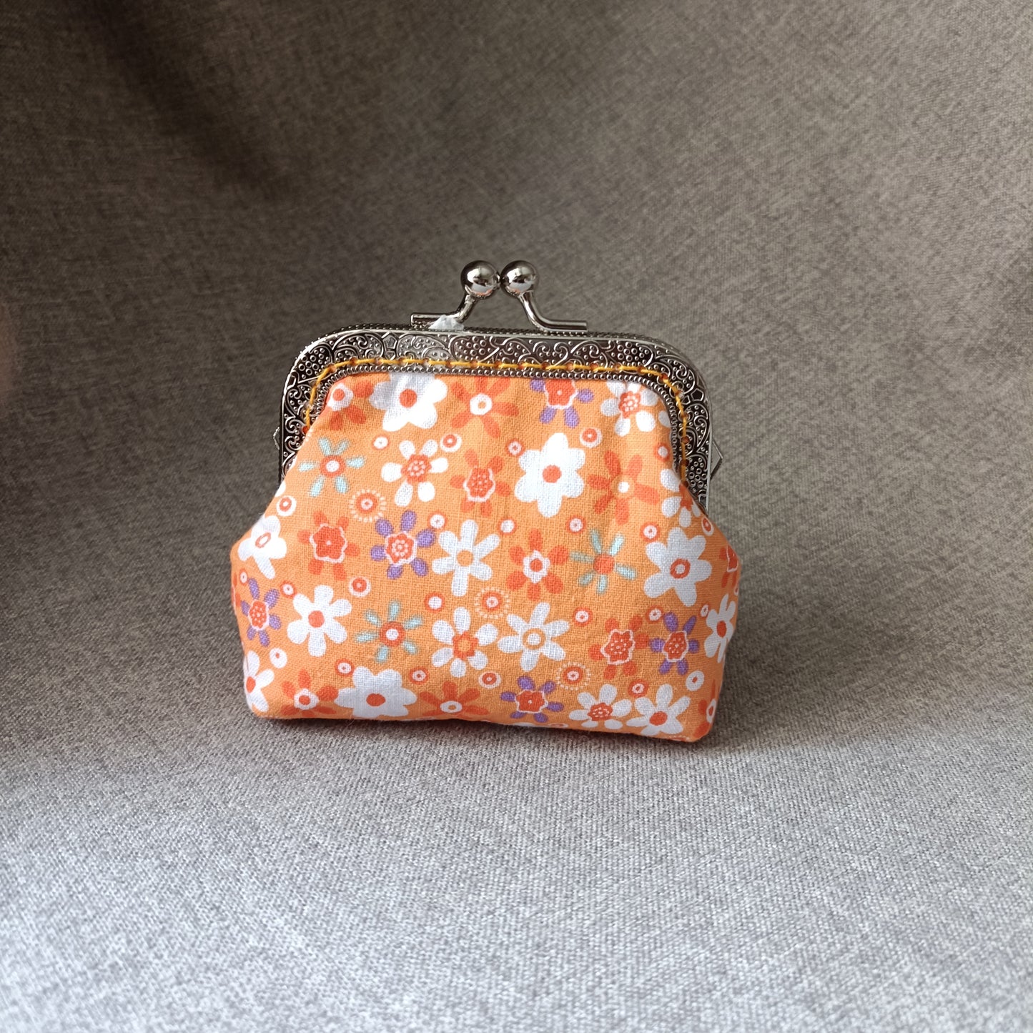 an orange flower card bag